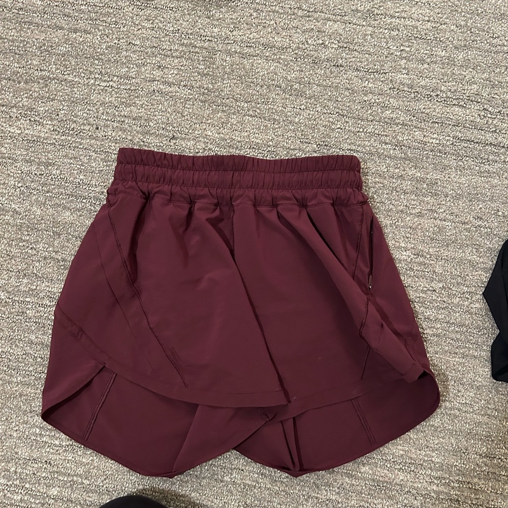 Lululemon track that short, 5 in in a magenta purple color